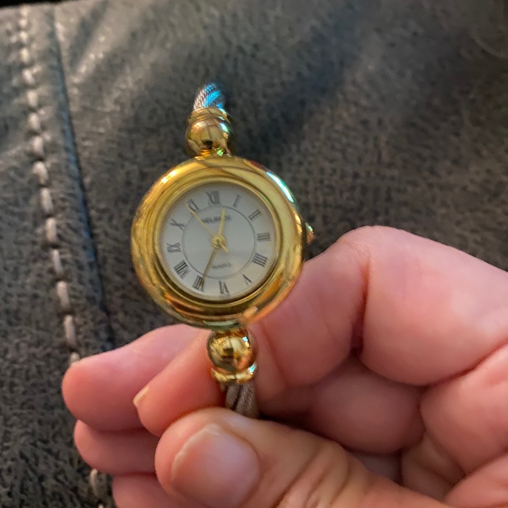 Silver and gold tone bangle style watch